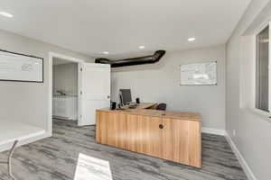 Home office featuring light wood-type flooring and sink