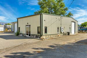 View of outbuilding featuring a garage