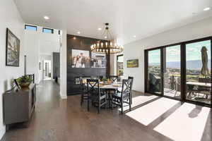 Versatile dining area complimented with a double sided fireplace and large doors leading out to the deck.