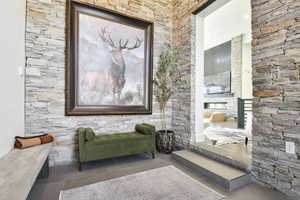 Large foyer area with plenty of seating for guests to remove their shoes.