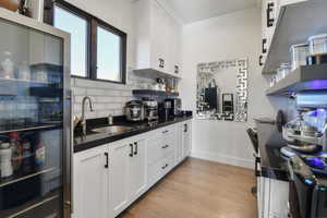 Butler's Pantry with lots of natural light, extra storage, cabinets, sink and food prep area.