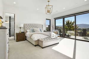 Owner's bedroom has a beautiful fireplace as well as doors leading out to the deck.