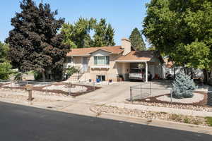 View of front of home with a carport