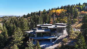 View of subject property featuring a heavily wooded area