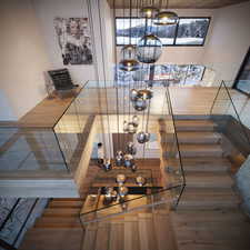 Stairway featuring hardwood / wood-style floors