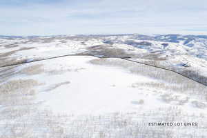 Snowy aerial view with a mountain view