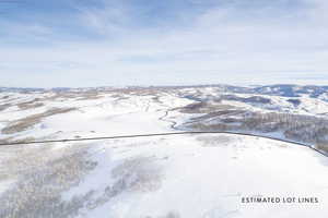 Snowy aerial view with a mountain view