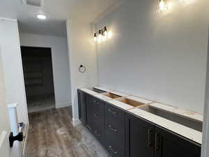 Primary Bathroom featuring hardwood / wood-style flooring