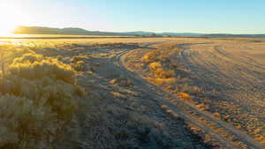 Drone / aerial view featuring a mountain view and a rural view