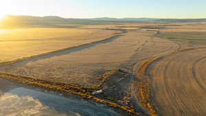 Aerial view at dusk featuring a mountain view