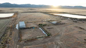 Aerial view with a water and mountain view and a rural view