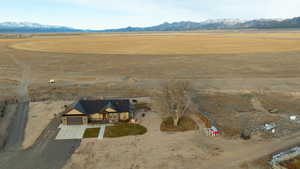 Drone / aerial view with a mountain view and a rural view