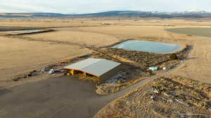 Birds eye view of property featuring a mountain view and a rural view