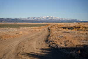 Property view of mountains with a rural view