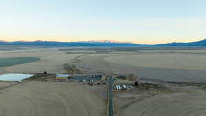 Aerial view at dusk featuring a mountain view