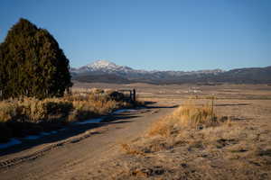 Property view of mountains with a rural view