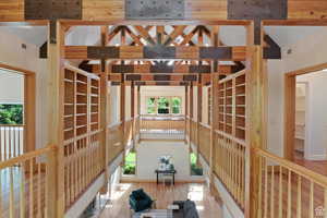 Interior space featuring wood-type flooring and vaulted ceiling