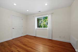 Unfurnished room featuring hardwood / wood-style flooring