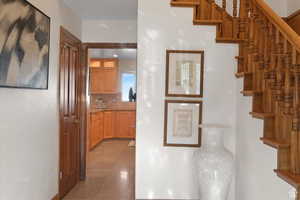 Corridor with light tile patterned floors