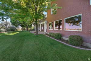 Exterior space featuring a lawn