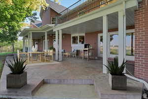 View of patio featuring a balcony