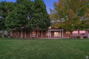 Obstructed view of property featuring a lawn