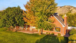 Exterior space featuring a patio area and a mountain view