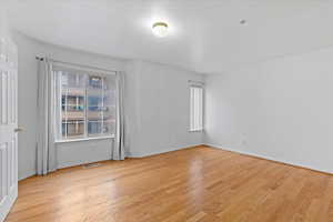 Spare room with light hardwood / wood-style floors