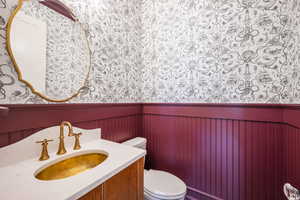 Bathroom featuring vanity and toilet