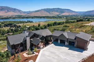 Aerial view featuring a water and mountain view