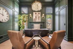 Sitting room featuring a chandelier and light hardwood / wood-style flooring