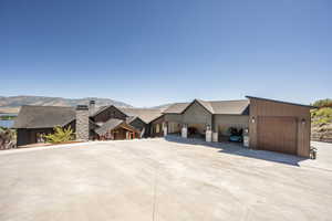 View of front facade featuring a mountain view and a garage