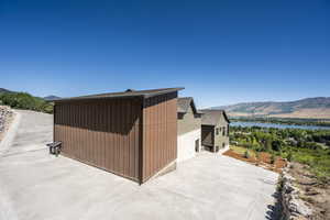 Exterior space with a water and mountain view