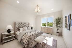 Carpeted bedroom with radiator heating unit