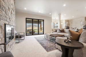 Carpeted living room featuring a mountain view