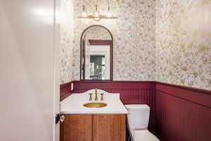 Bathroom featuring vanity and toilet