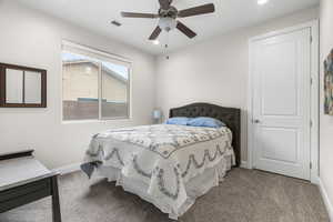 Bedroom featuring ceiling fan and light colored carpet