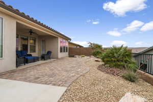 Exterior space with ceiling fan and an outdoor living space