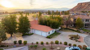 Aerial view at dusk with a golf course and mountain view