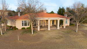 Rear view of house featuring a patio area