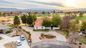 Aerial view at dusk with a golf course and mountain view