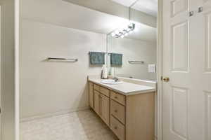 downstairs bathroom with vanity.