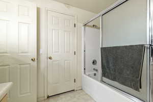 Second photo of bathroom with enclosed tub / shower combo