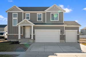 Craftsman house featuring a garage