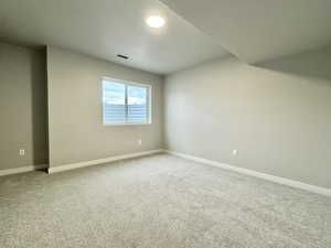 Unfurnished room featuring carpet