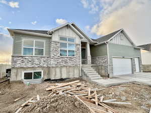 View of front of property featuring a garage