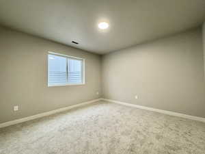 View of carpeted spare room