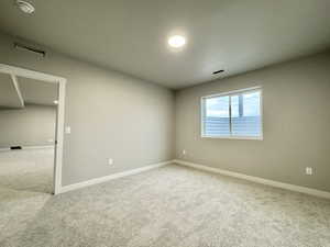 Empty room with carpet flooring