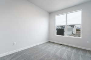 Unfurnished room with carpet floors