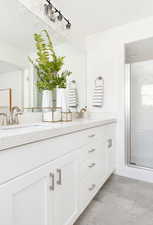 Bathroom with vanity and walk in shower